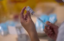 A syringe is loaded with the Moderna COVID-19 vaccine