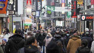 FILE - People fill up the shopping streets in Cologne, Germany, Wednesday, Nov. 17, 2021.