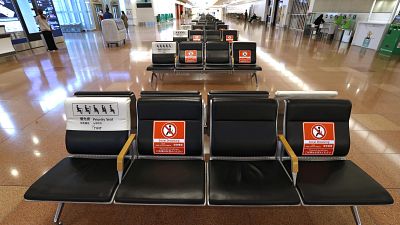The arrival lobby of the international terminal is deserted at Haneda Airport in Tokyo, Japan, Tuesday, Nov. 30, 2021.