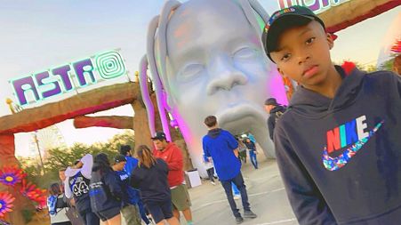 9-year-old Astroworld victim Ezra Blount posing outside the music festival in Houston, Texas