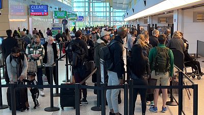 People queue at a US airport