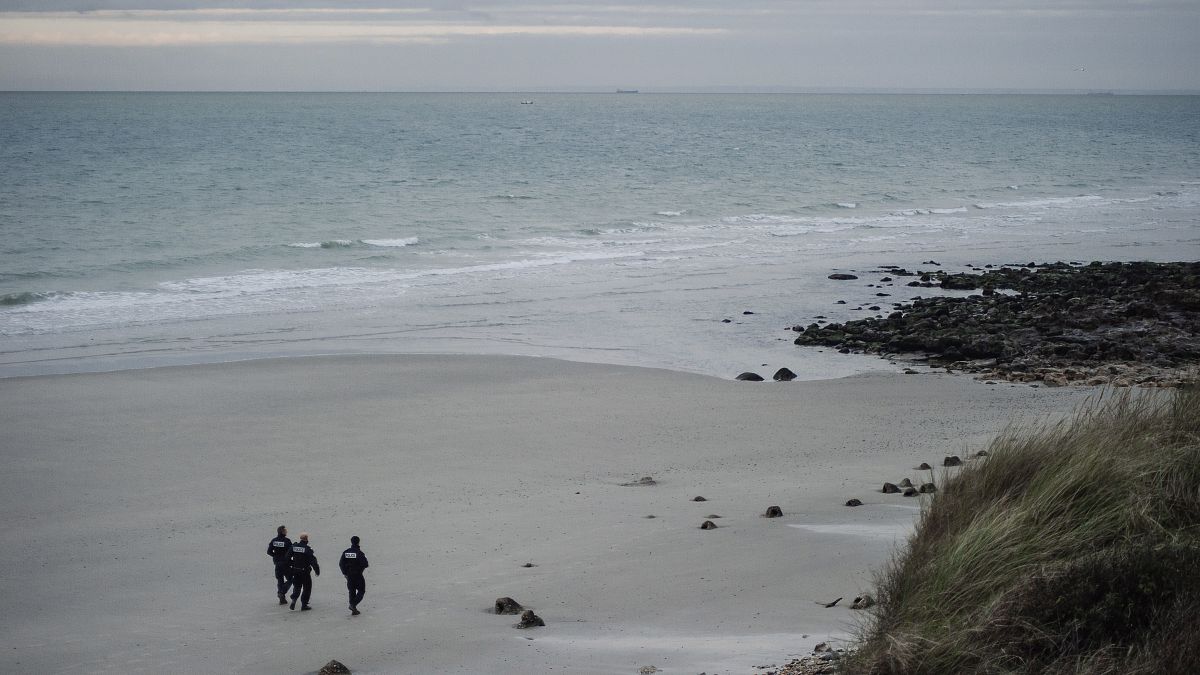 French police officers patrol on the beach in the searcher migrants in Wimereux.