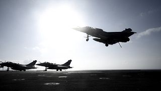 A Rafale fighter jet lands on deck of the French aircraft carrier Charles de Gaulle, off the coast of the city of Hyeyres, southern France, Thursday, Jan. 23, 2020.