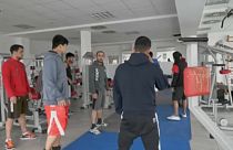 Afghan national boxing team warm up in a hotel gym in Belgrade, 26th November 2021.