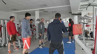 Afghan national boxing team warm up in a hotel gym in Belgrade, 26th November 2021.