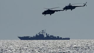Ukrainian helicopters fly over a Russian warship during Ukraine-NATO Sea Breeze 2021 manoeuvres, in the Black Sea, Friday, July 9, 2021.