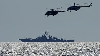 Ukrainian helicopters fly over a Russian warship during Ukraine-NATO Sea Breeze 2021 manoeuvres, in the Black Sea, Friday, July 9, 2021. 