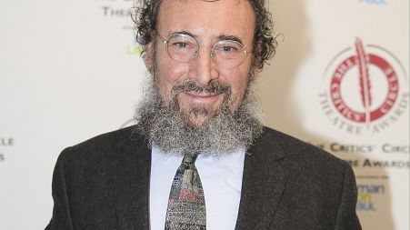 Antony Sher poses for photographers after winning the best Shakespearean performance award at the Critics' Circle Theatre Awards in central London Jan. 27, 2015