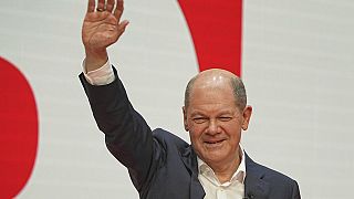 Olaf Scholz, SPD Chancellor-designate waves at the SPD party conference at Willy Brandt House in Berlin, Germany, Saturday, Dec.4, 2021