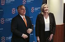 French far-right leader Marine Le Pen and Hungarian Prime Minister Viktor Orban pose before a meeting of nationalist leaders in Warsaw, Poland, Saturday, Dec.4, 2021.