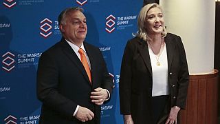 French far-right leader Marine Le Pen and Hungarian Prime Minister Viktor Orban pose before a meeting of nationalist leaders in Warsaw, Poland, Saturday, Dec.4, 2021.