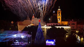 Famed Manger Square Christmas tree lit up