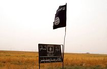Islamic State flag in an area after peshmerga regained control of some villages west of Kirkuk
