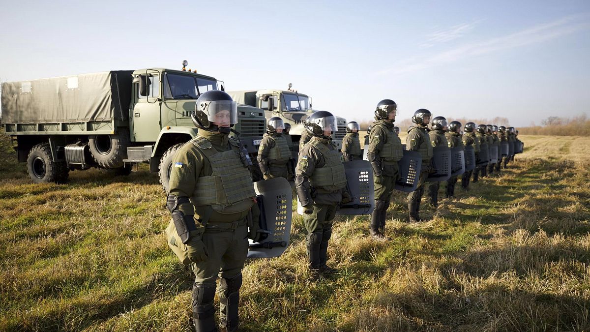 Soldiers of the Ukrainian State Border Guard Service line up at the border with Belarus in the Volyn region.