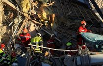 French firefighters search the rubble for missing inhabitants after a building collapsed in Sanary-sur-Mer, on December 7, 2021.