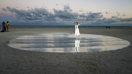 Dancer and choreographer Su Wen-Chi, of Taiwan, performs a dance titled "Moving Towards the Horizon" on the beach during Miami Art Week, Wednesday, Dec. 1, 2021.