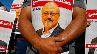 People hold posters of Jamal Khashoggi, near the Saudi Arabia consulate in Istanbul 
