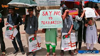 Bangladeshi students form a human chain to protest against terrorism in Dhaka