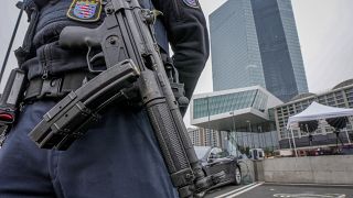 A German police officer guards the European Central Bank in Frankfurt, Thursday, Oct. 28, 2021.