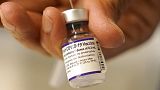 FILE - Dr. Manjul Shukla transfers Pfizer COVID-19 vaccine into a syringe, Thursday, Dec. 2, 2021, at a mobile vaccination clinic in Worcester, USA