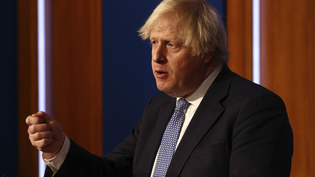 Britain's Prime Minister Boris Johnson speaks at a press conference in London's Downing Street, Wednesday Dec. 8, 2021, 