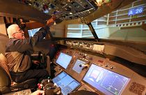 Muhammad Malhas, 76, operates his flight simulator cockpit at his home in Jordan's capital Amman on November 8, 2021.