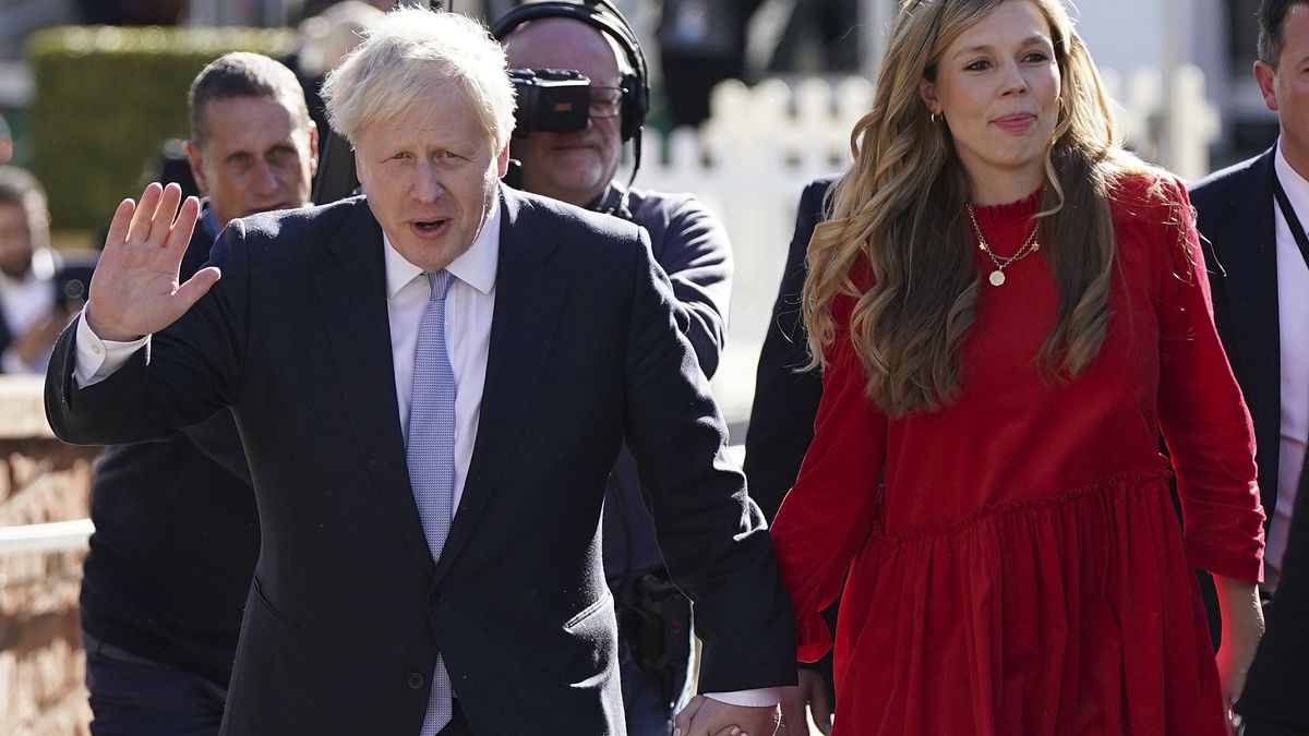 Britain's Prime Minister Boris Johnson with his wife Carrie Johnson before he makes his keynote speech at the Conservative party conference in Manchester, Oct. 6, 2021.