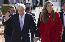 Britain's Prime Minister Boris Johnson with his wife Carrie Johnson before he makes his keynote speech at the Conservative party conference in Manchester, Oct. 6, 2021.