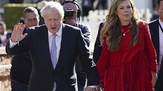 Britain's Prime Minister Boris Johnson with his wife Carrie Johnson before he makes his keynote speech at the Conservative party conference in Manchester, Oct. 6, 2021.