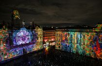People attend the Fêtes des Lumières in Lyon, France, Wednesday, Dec. 8, 2021.