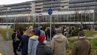 People queue to get the vaccinated against the COVID-19 virus in front of the Petz Aladar Hospital in Gyor, Hungary