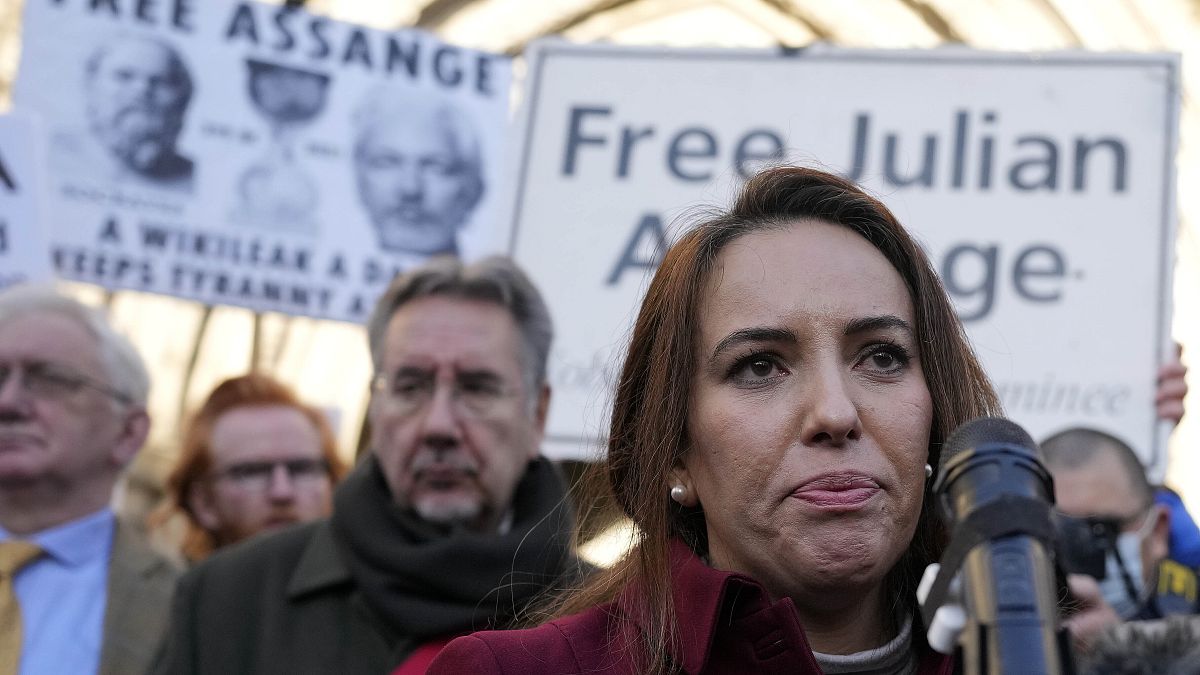 Stella Moris, partner of Julian Assange, speaks to journalists in front of the High Court in London, Friday, Dec. 10, 2021