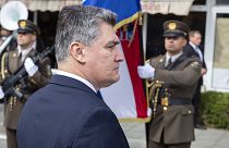 Croatia's President Zoran Milanović reviews the honour guards as he arrives at a ceremony in Knin, Croatia, Wednesday, Aug. 5, 2020