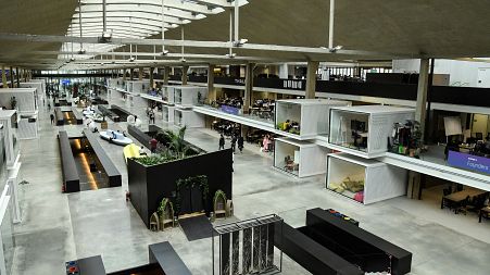 People work at the "Station F" start up campus in Paris, 2018.