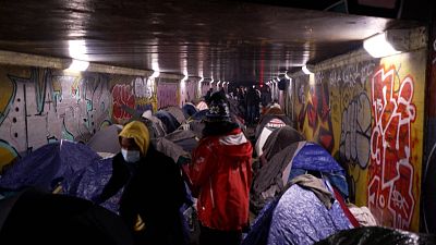 Migrants' tents in a tunnel under the Paris ring road.