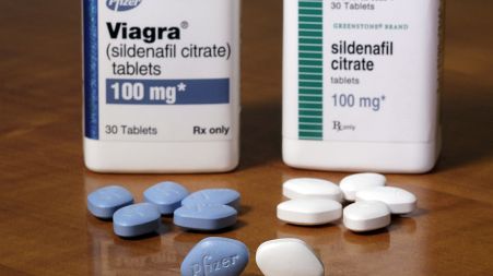 This Monday, Dec. 4, 2017 photo shows Pfizer's Viagra, left, and the company's generic version, sildenafil citrate, at Pfizer Inc., headquarters in New York.