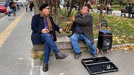 Garcia with the Bulgarian busker who played The Godfather theme in Sofia, Bulgaria