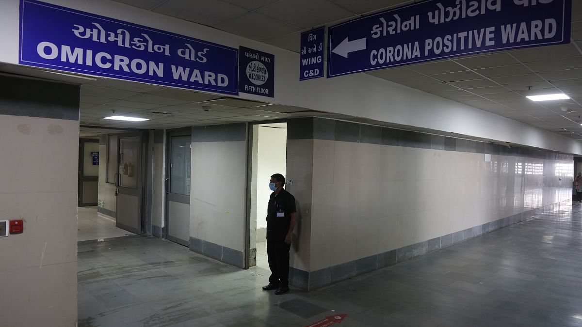 A security guard stands in position outside a ward being prepared for the omicron coronavirus variant at Civil hospital in Ahmedabad, India, Dec. 6, 2021. 
