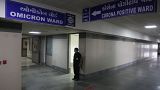 A security guard stands in position outside a ward being prepared for the omicron coronavirus variant at Civil hospital in Ahmedabad, India, Dec. 6, 2021.