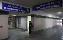 A security guard stands in position outside a ward being prepared for the omicron coronavirus variant at Civil hospital in Ahmedabad, India, Dec. 6, 2021. 