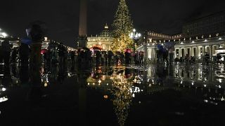 A view of the nativity scene and the Christmas tree that adorn St. Peter's square at the Vatican, during the lighting ceremony, Friday, Dec. 10, 2021.