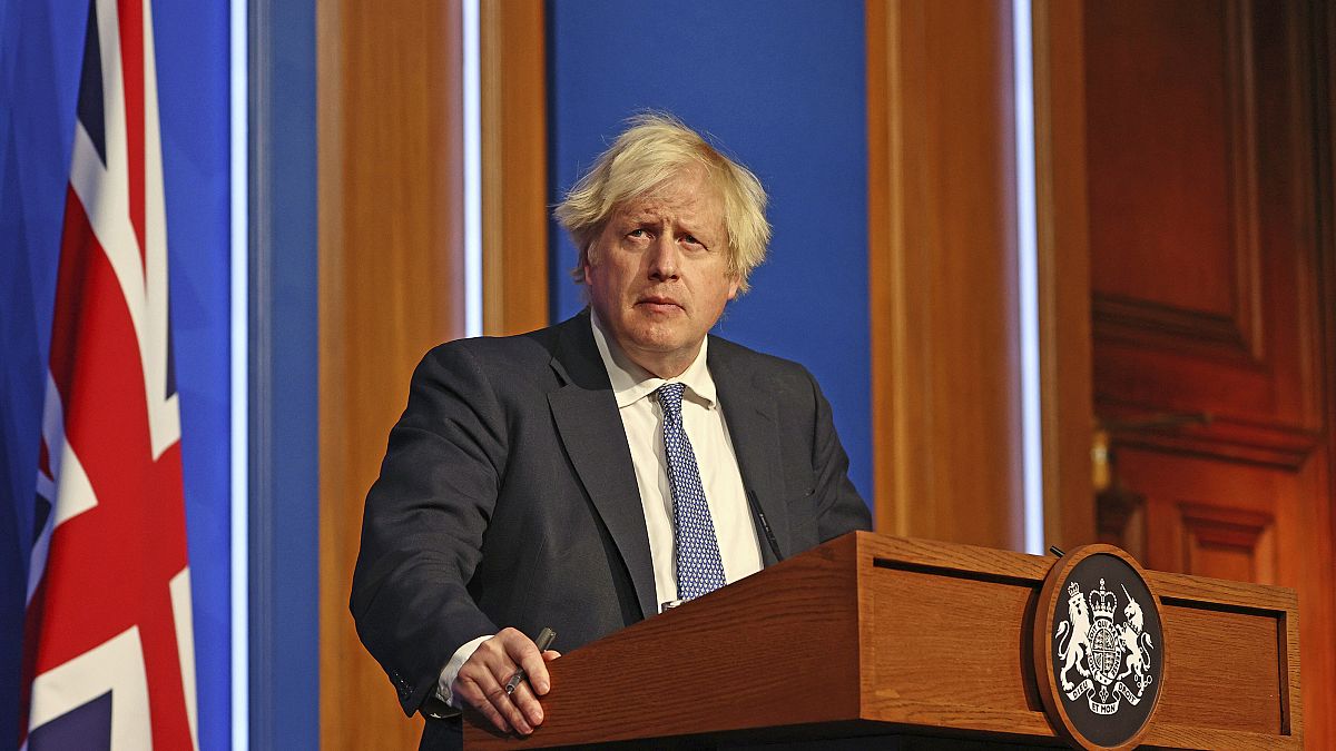 Britain's Prime Minister Boris Johnson speaks at a press conference in London's Downing Street, Wednesday Dec. 8, 2021.