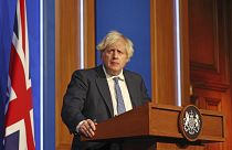 Britain's Prime Minister Boris Johnson speaks at a press conference in London's Downing Street, Wednesday Dec. 8, 2021.