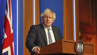 Britain's Prime Minister Boris Johnson speaks at a press conference in London's Downing Street, Wednesday Dec. 8, 2021.