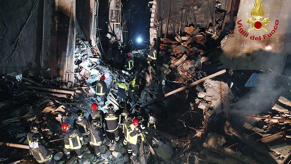 Italian firefighters and rescuers search for survivors among the rubble of a collapsed building, in Ravanusa, Sicily, Italy.