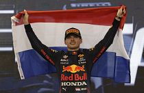 Red Bull driver Max Verstappen of the Netherlands celebrates on the podium after becoming F1 drivers world champion
