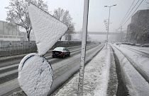 Cars on the street during snow storm in Belgrade, Serbia, Sunday, Dec. 12, 2021.