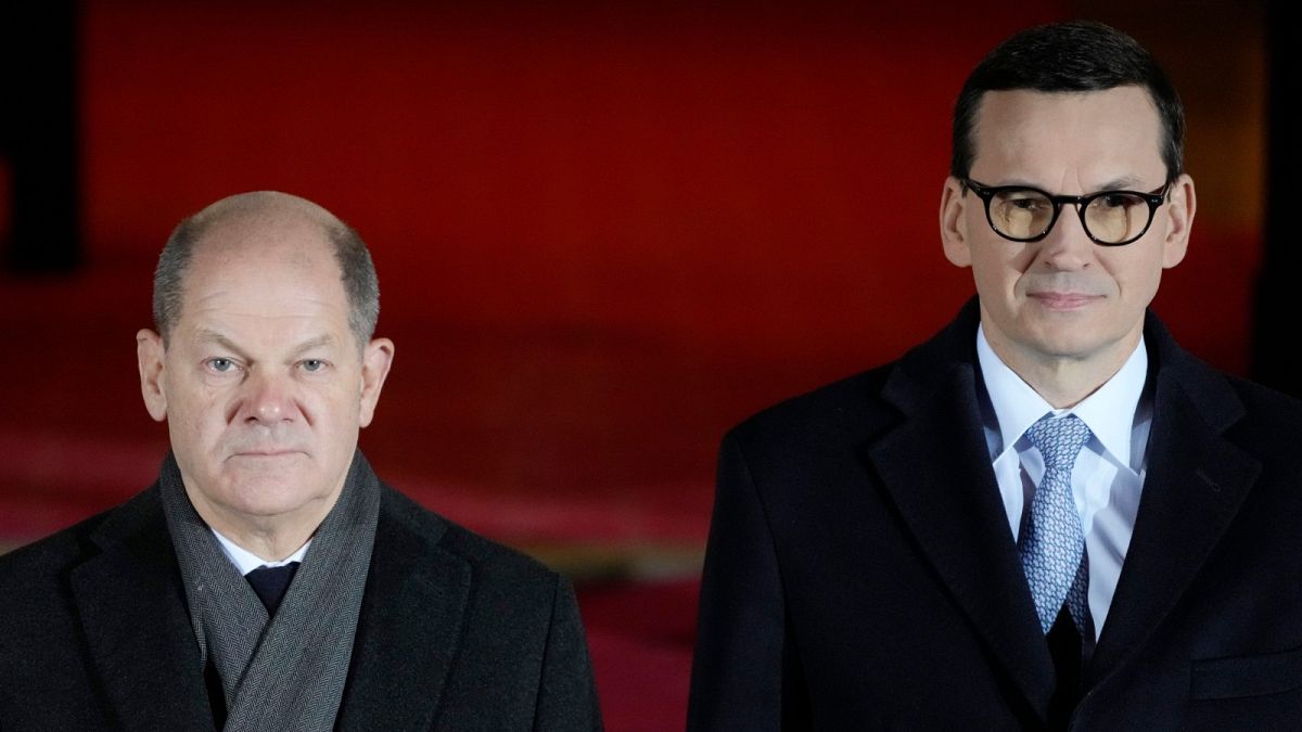 Germany's new chancellor, Olaf Scholz, left, being greeted by Poland's Prime Minister Mateusz Morawiecki in Warsaw, Poland.