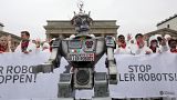 People take part in a demonstration as part of the campaign "Stop Killer Robots" organised by German NGO "Facing Finance" in Berlin, on March 21, 2019.