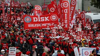 People march during a protest by Turkish trade unions DISK against the government's economy policies in Istanbul, Turkey, Sunday, Dec. 12, 2021.